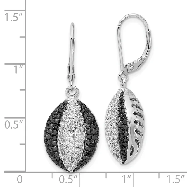 Pair of silver leverback earrings with black and white cubic zirconia stones arranged in a striped pattern, shown against a measurement scale.