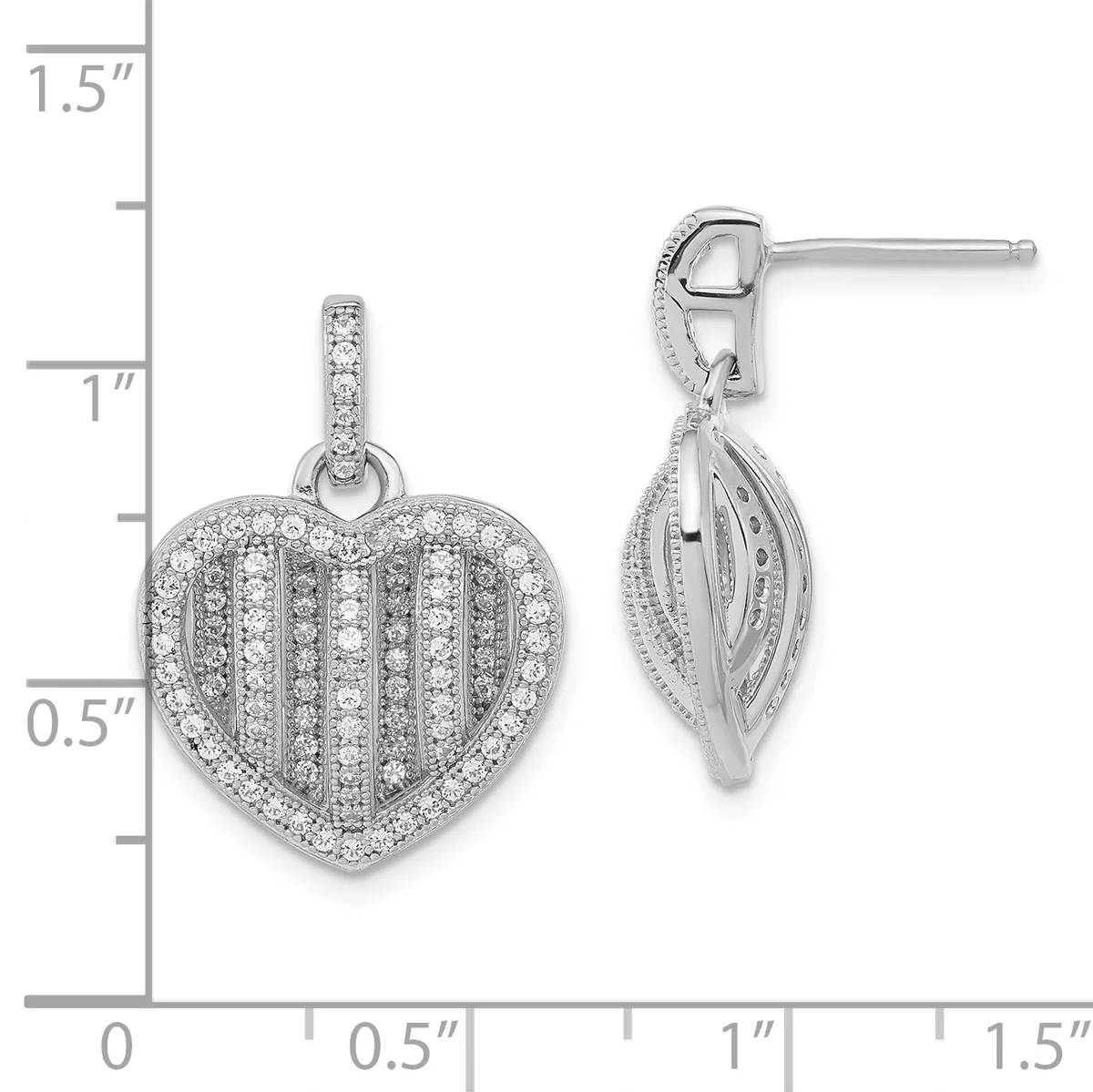 Silver heart-shaped pendant and matching drop earrings with vertical stripe pattern and cubic zirconia stones, shown next to a measurement ruler.
