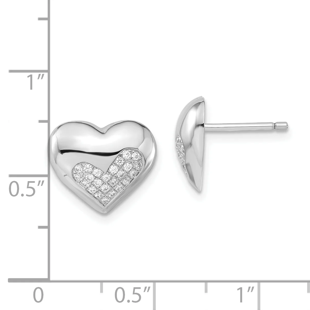 Pair of polished silver heart-shaped stud earrings with diamond pave accents on the lower half, shown next to a measurement scale.