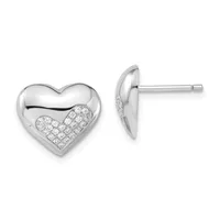A pair of silver heart-shaped stud earrings with polished surfaces and diamond-paved lower halves, shown from front and side views.