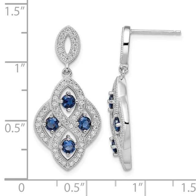 Pair of diamond and sapphire drop earrings with diamond-paved oval tops and diamond-paved quatrefoil bottoms set with four round sapphires, shown front and side view with measurement scale.