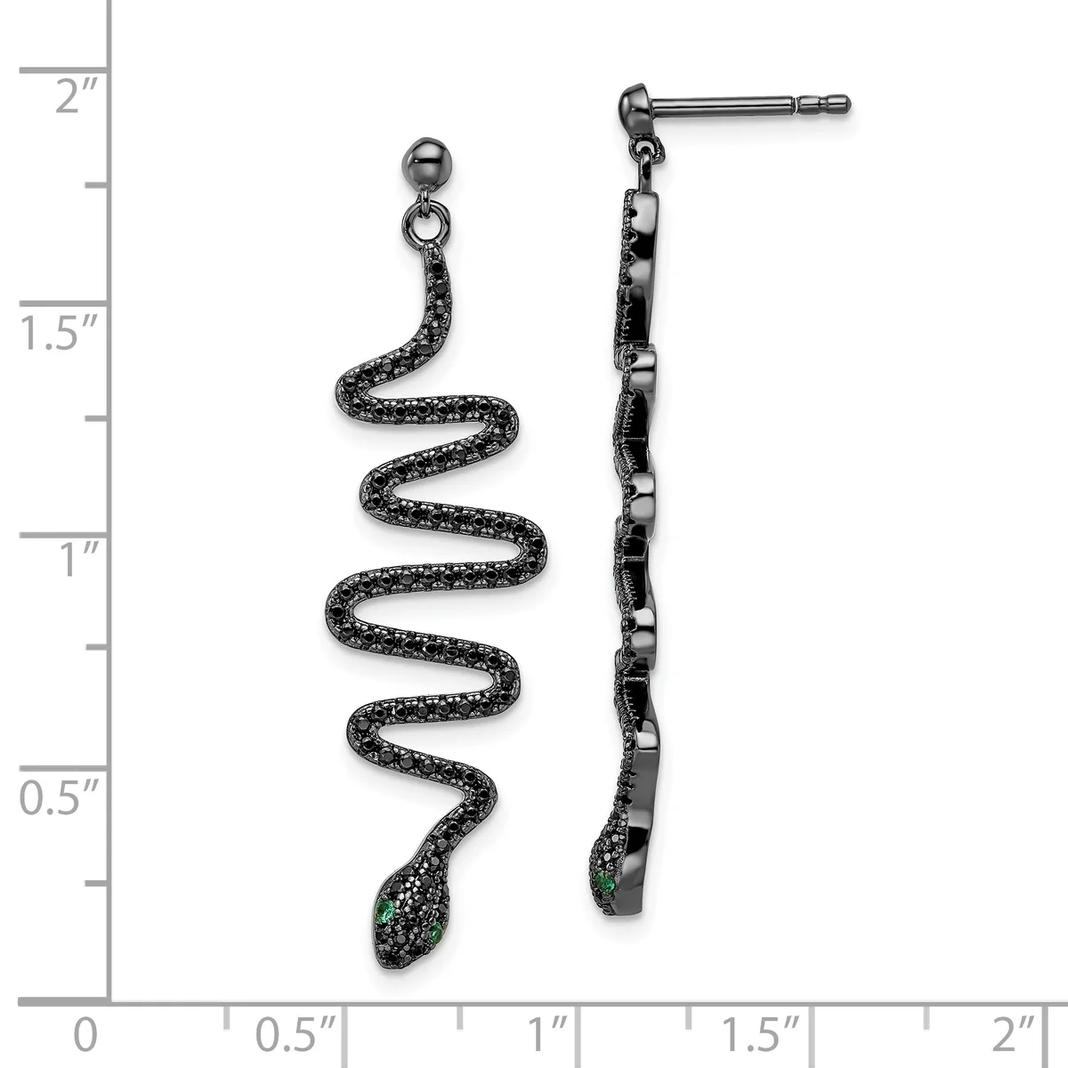 A pair of black textured snake-shaped drop earrings with green stone accents on the posts, displayed against a ruler showing approximately two inches in length.