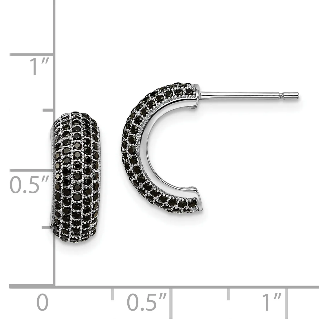A pair of black gemstone-studded curved hoop earrings with a polished silver finish, displayed against a measurement scale showing approximately one inch in length.