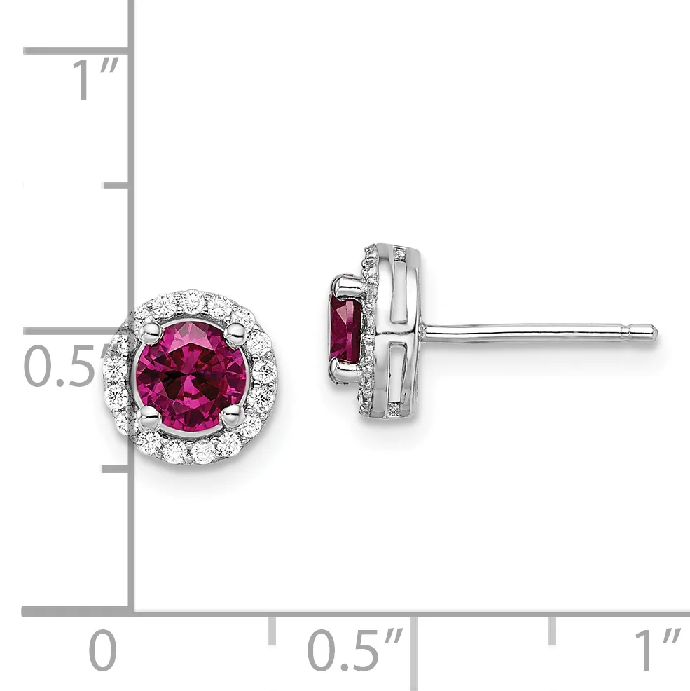 Pair of silver stud earrings with round pink tourmaline centers surrounded by small diamonds, shown front and side view against a measurement scale.