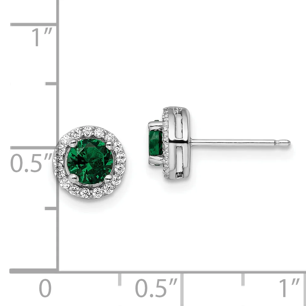 Pair of silver stud earrings with round green gemstones surrounded by small clear crystals, shown front and back view next to a measurement scale.