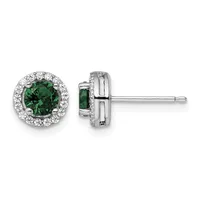 A pair of silver stud earrings with round green gemstones surrounded by small white diamonds, shown from front and side views.