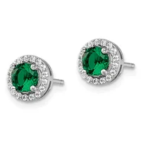 Pair of silver stud earrings with round emerald-green gemstones surrounded by small diamonds in halo settings.