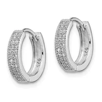 A pair of silver hoop earrings with a textured, glittery surface and hinged closures, shown from a front view against a white background.