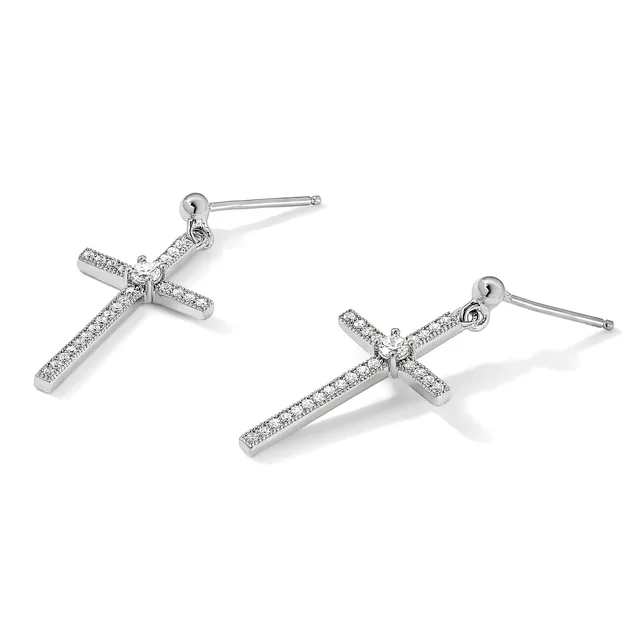 A pair of silver cross-shaped drop earrings with round diamond accents, shown from two angles against a white background.