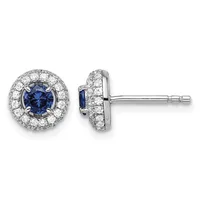 Pair of round stud earrings with blue sapphire centers surrounded by diamond halos in white metal, shown from front and side views.