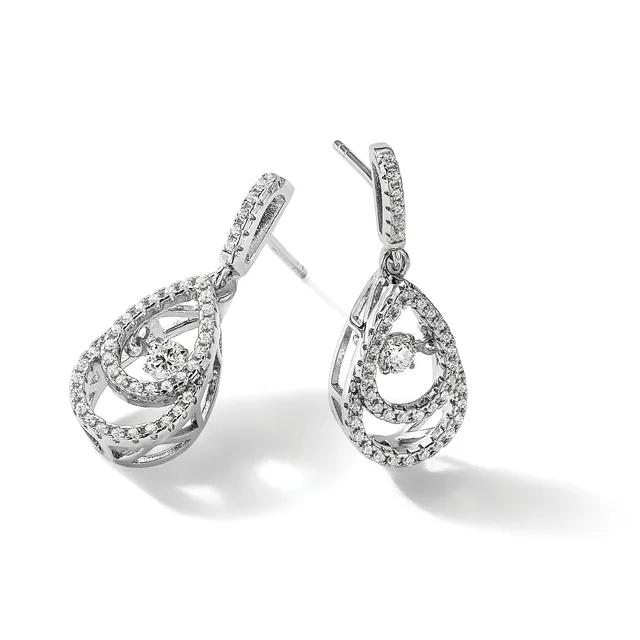 A pair of silver teardrop-shaped dangle earrings with pear-cut diamonds at the center surrounded by pavé-set smaller diamonds, displayed against a white background.