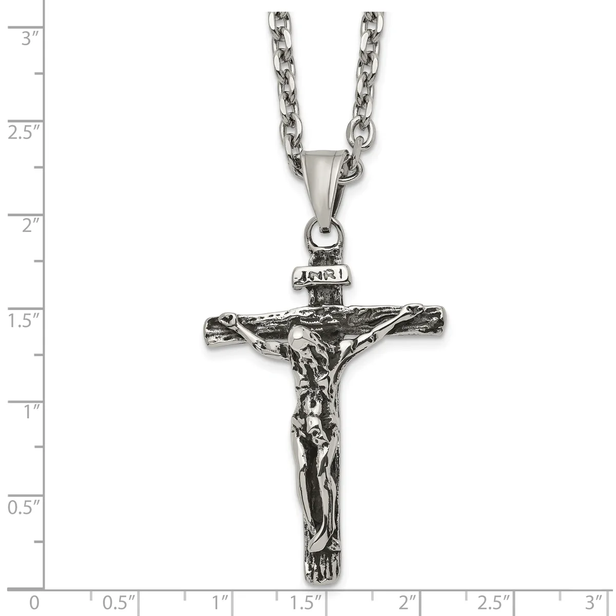 Stainless steel antiqued crucifix pendant with INRI inscription on a chain necklace, shown against a white background with inch measurement rulers.