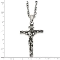 Stainless steel antiqued crucifix pendant with INRI inscription on a chain necklace, shown against a white background with inch measurement rulers.