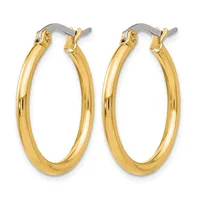 Pair of polished gold-tone oval hoop earrings with silver-toned hinged clasp closures, stamped Stainless Steel China on the inner band.