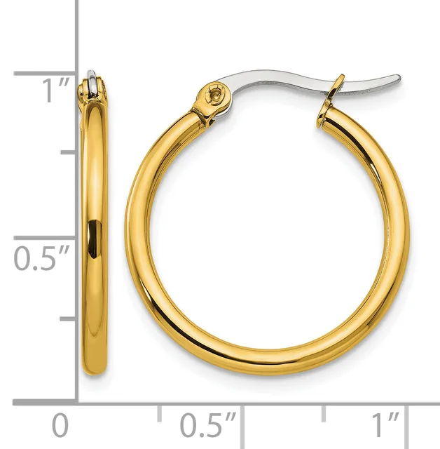A pair of polished yellow gold hoop earrings with a silver snap closure, shown next to a ruler indicating approximately 1 inch in diameter.