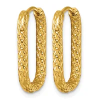 A pair of gold-toned textured oval hoop earrings with a dimpled surface pattern and hinged closures.
