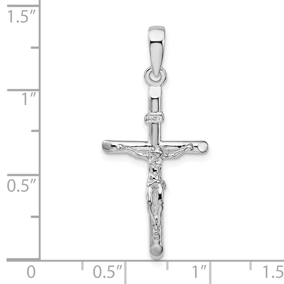 A silver crucifix pendant shown against a measurement scale, approximately 1.25 inches tall, featuring a detailed corpus with a polished finish and a small hallmark stamp near the bail.