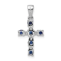 A sterling silver cross pendant featuring alternating round blue sapphires and small diamonds set in bezel settings along the vertical and horizontal arms, with a small hallmark visible on the bail.
