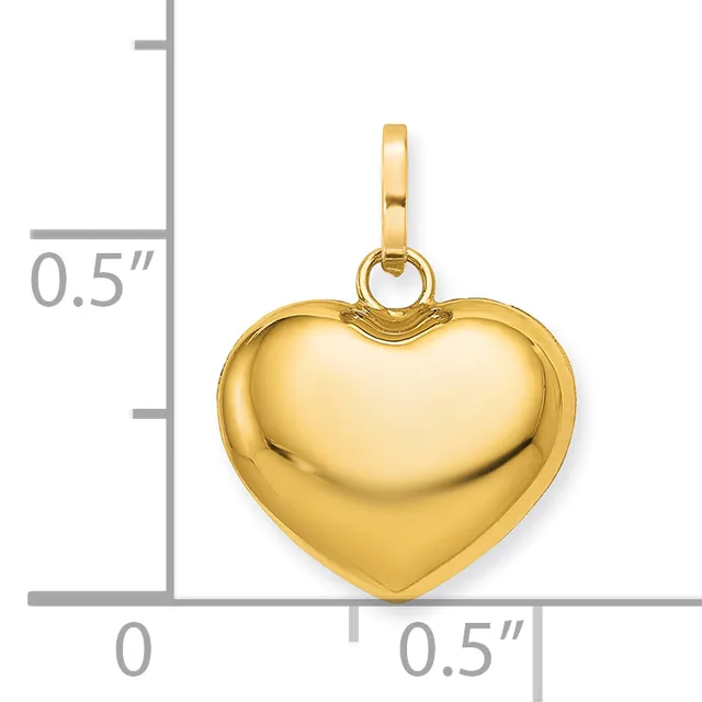 Gold-colored polished heart pendant with a bail loop, shown next to a ruler indicating approximately 0.5 inches in height and width.