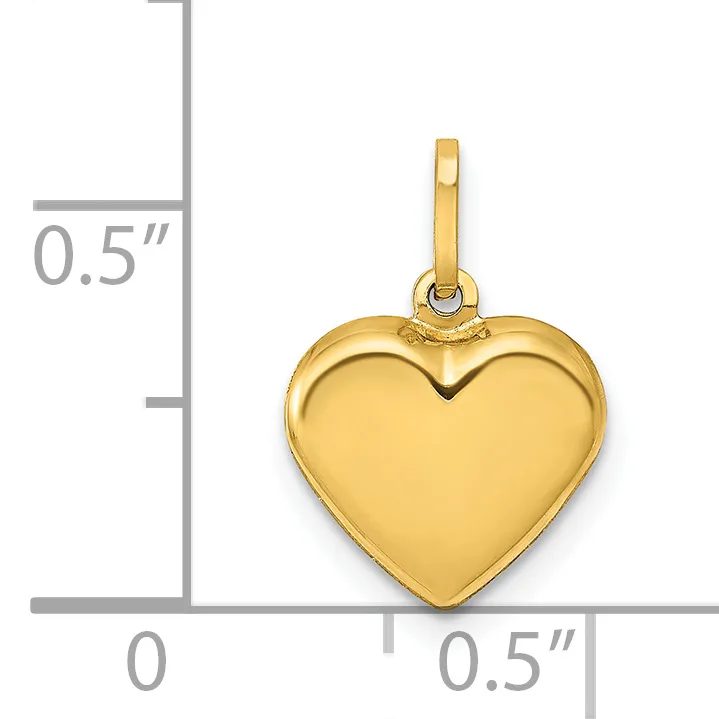 Polished gold-colored heart pendant with bail and loop, shown next to a measurement scale indicating approximately 0.5 inches in width and height.