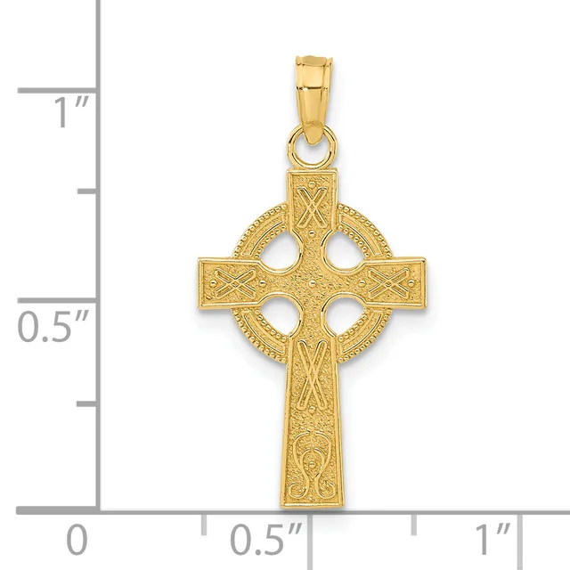 Gold-toned Celtic cross pendant with ornate detailing and circular cutouts, shown next to a ruler indicating approximately one inch in height.