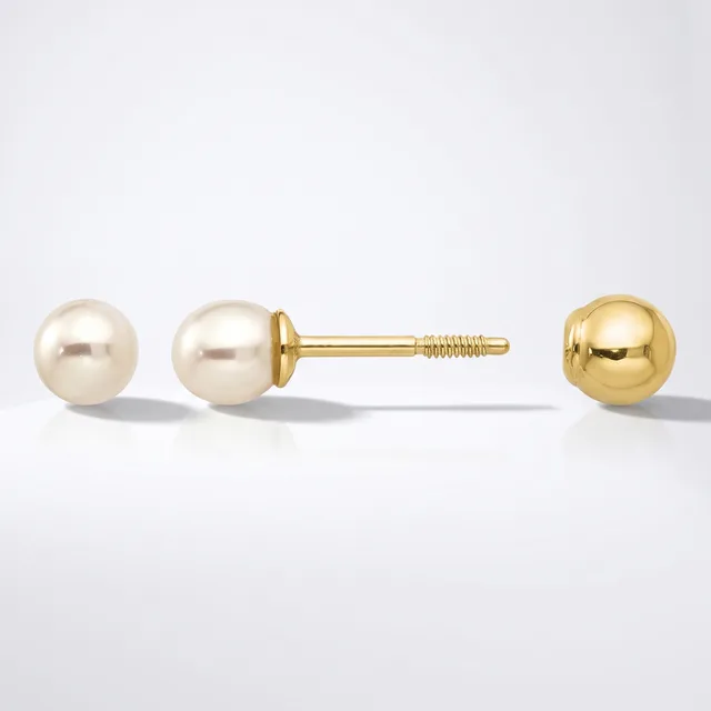 A pair of gold stud earrings with pearl spheres displayed alongside a single matching gold sphere earring, shown from front and side angles.