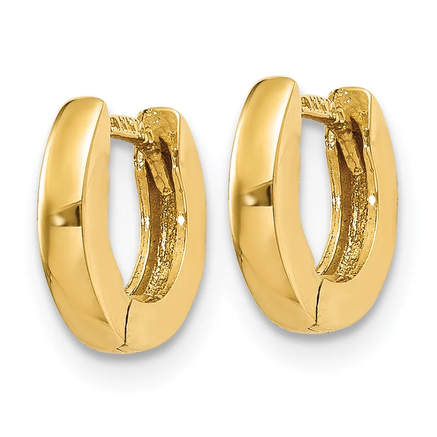 A pair of polished gold hoop earrings with textured inner surfaces and hinged closures, displayed against a white background.