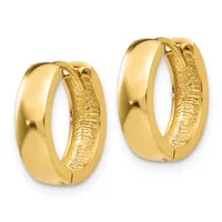 A pair of polished gold hoop earrings with textured inner surfaces, shown from the front against a white background.