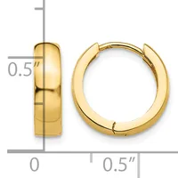 A pair of polished gold-toned chunky hoop earrings with a hinged closure, shown against a measurement scale indicating approximately 0.5 inches in width.