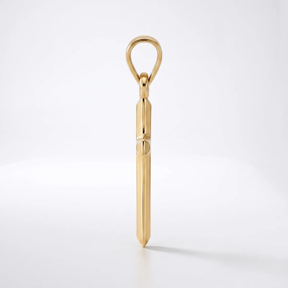A polished gold pendant in the shape of a vertical elongated teardrop with a loop at the top, shown against a white background.