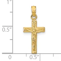 Gold crucifix pendant with textured surface and small loop bail, shown against a measurement scale indicating approximately 0.5 inches wide and 1 inch tall.