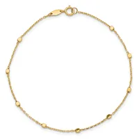 A gold chain bracelet with evenly spaced small spherical beads, featuring a lobster clasp closure, displayed against a white background.