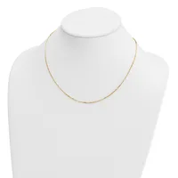 A delicate gold-toned chain necklace displayed on a white mannequin bust.