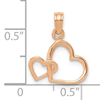 Rose gold pendant featuring two interlocking hearts of different sizes with an open design and a small stamped hallmark, shown against a measurement scale.