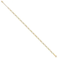 A delicate gold-toned chain bracelet with small oval links displayed diagonally against a white background.