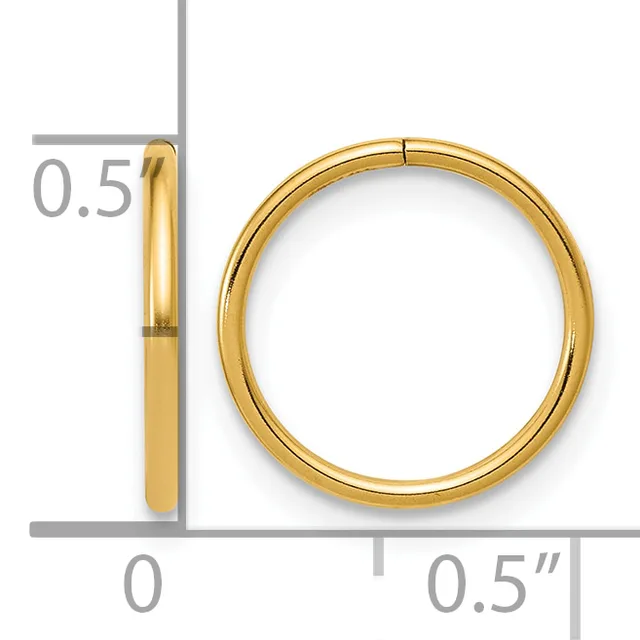 A polished gold-colored circular bangle bracelet shown next to a ruler indicating its dimensions of approximately 0.5 inches in width and diameter.