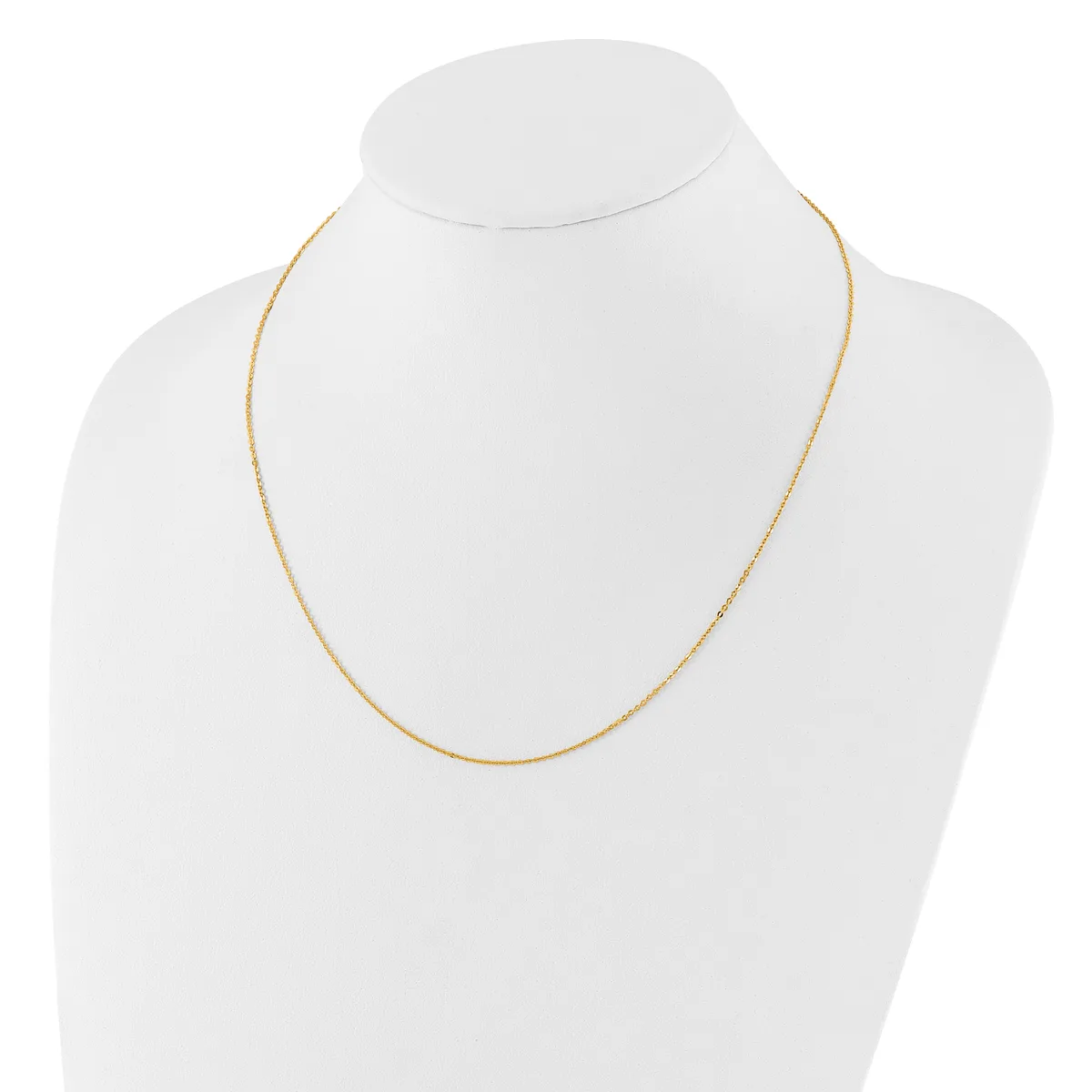 A thin gold-toned chain necklace displayed on a white mannequin bust.