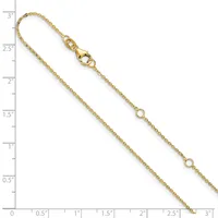 Gold-toned chain bracelet with lobster clasp and small circular link stations along its length, displayed against a ruler showing approximately 3 inches.
