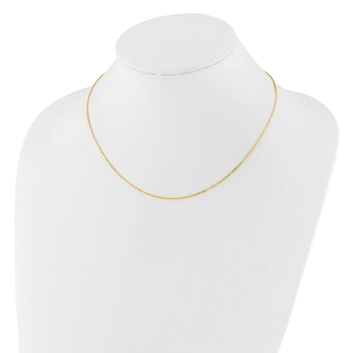 A delicate gold-toned chain necklace displayed on a white mannequin bust.
