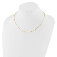 A delicate gold-toned chain necklace displayed on a white mannequin bust.