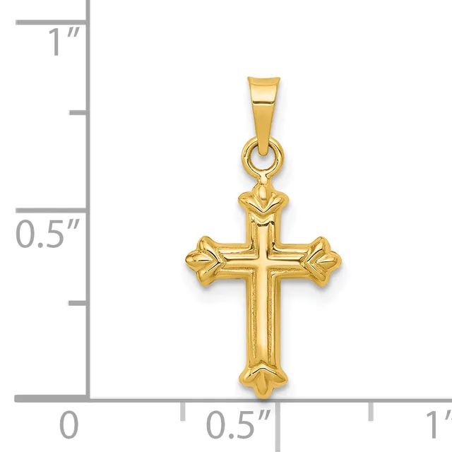 A gold cross pendant with flared ends and a small stamped hallmark, displayed against a ruler showing it measures approximately 0.75 inches wide and 1 inch tall.