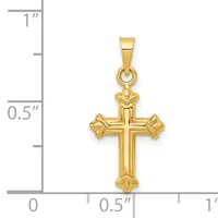 A gold cross pendant with flared ends and a small stamped hallmark, displayed against a ruler showing it measures approximately 0.75 inches wide and 1 inch tall.