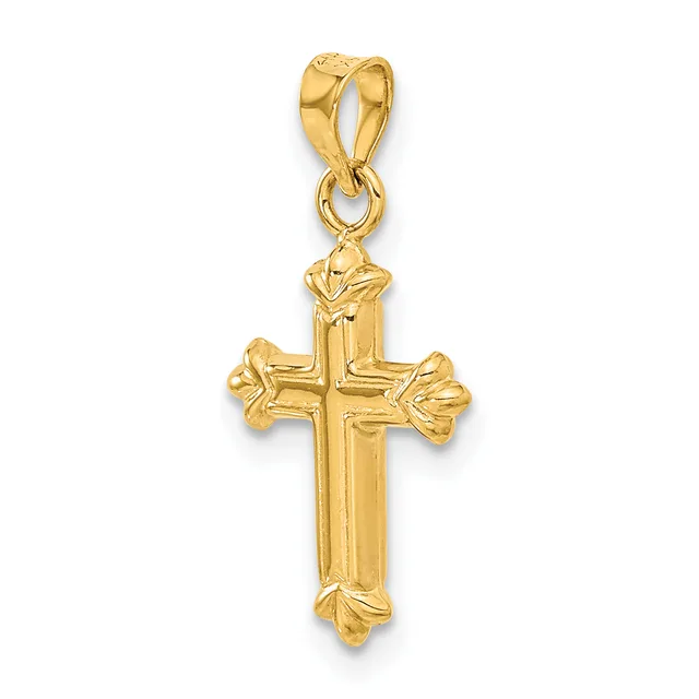 A gold cross pendant with ornate floral details at each end, suspended from a gold bail loop.