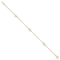 Gold chain bracelet with four pearl stations evenly spaced along its length, featuring a small clasp at each end.