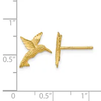 A pair of gold hummingbird stud earrings shown next to a ruler for scale, measuring approximately 0.75 inches tall with textured wings and bodies.