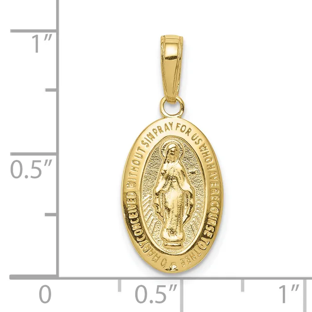 Gold oval religious medal pendant with figure of Mary and text around the border, displayed next to a ruler showing it measures approximately one inch in height.