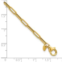 Gold-toned paperclip chain bracelet with a lobster clasp and small charm, displayed against a ruler showing approximately 2 inches in length.