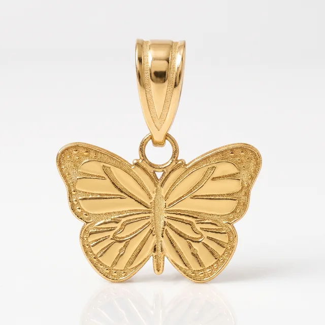 Gold butterfly pendant with detailed wing engravings and textured edges, featuring a bail loop at the top for attaching to a chain.