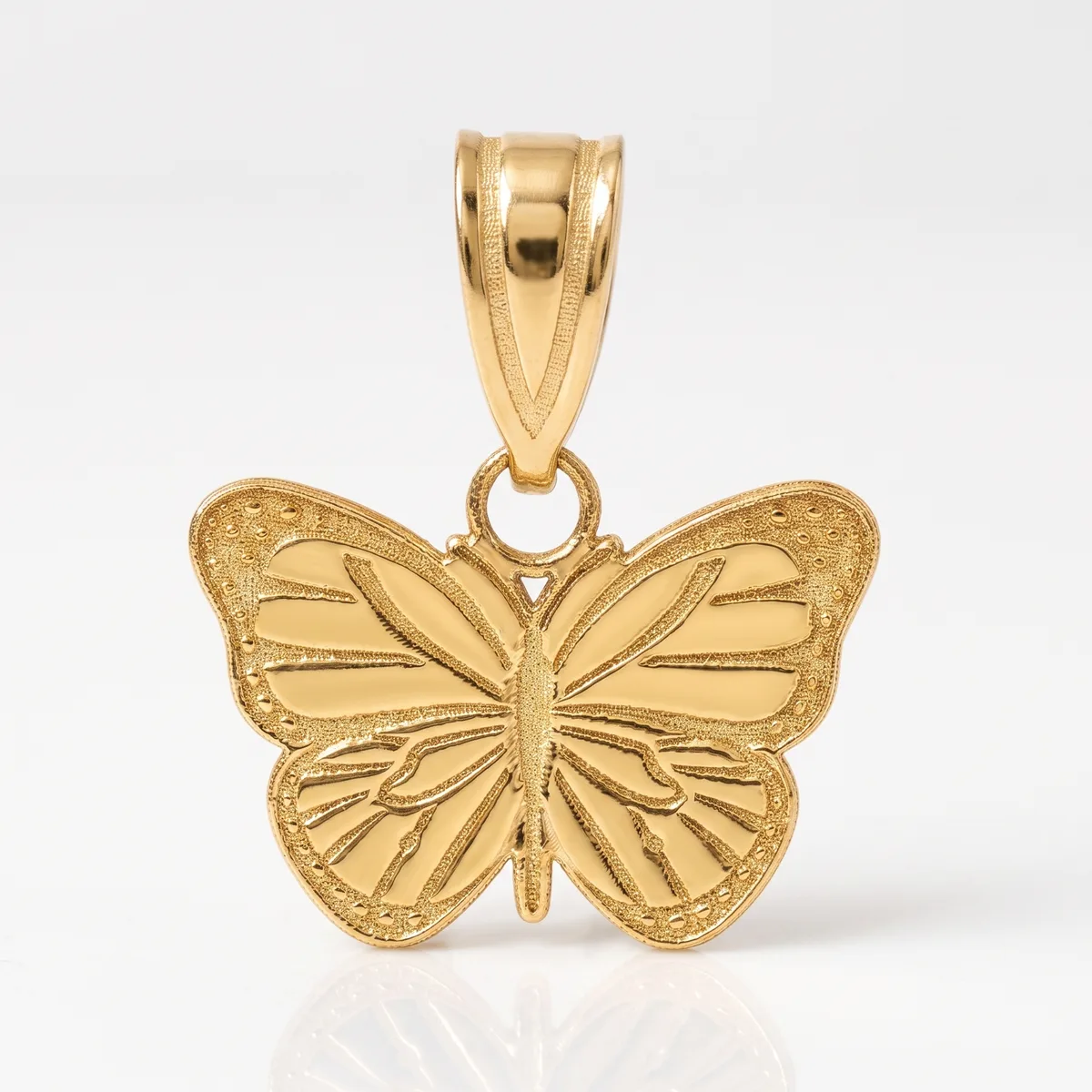 Gold butterfly pendant with detailed wing engravings and textured edges, featuring a bail loop at the top for attaching to a chain.