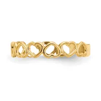 Gold-colored metal bangle bracelet with repeating open heart and infinity loop cutout design, shown on white background.